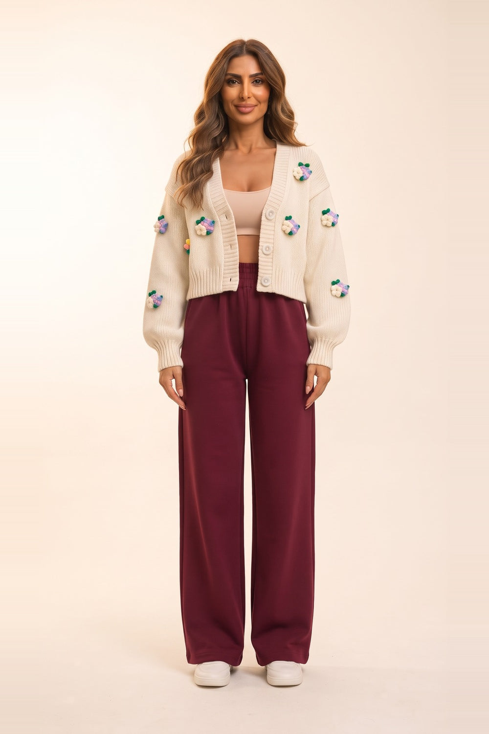 Women's cream cropped cardigan and burgundy wide leg pants set – 3D flower appliqué knit cardigan, on model | Topline Lebanon