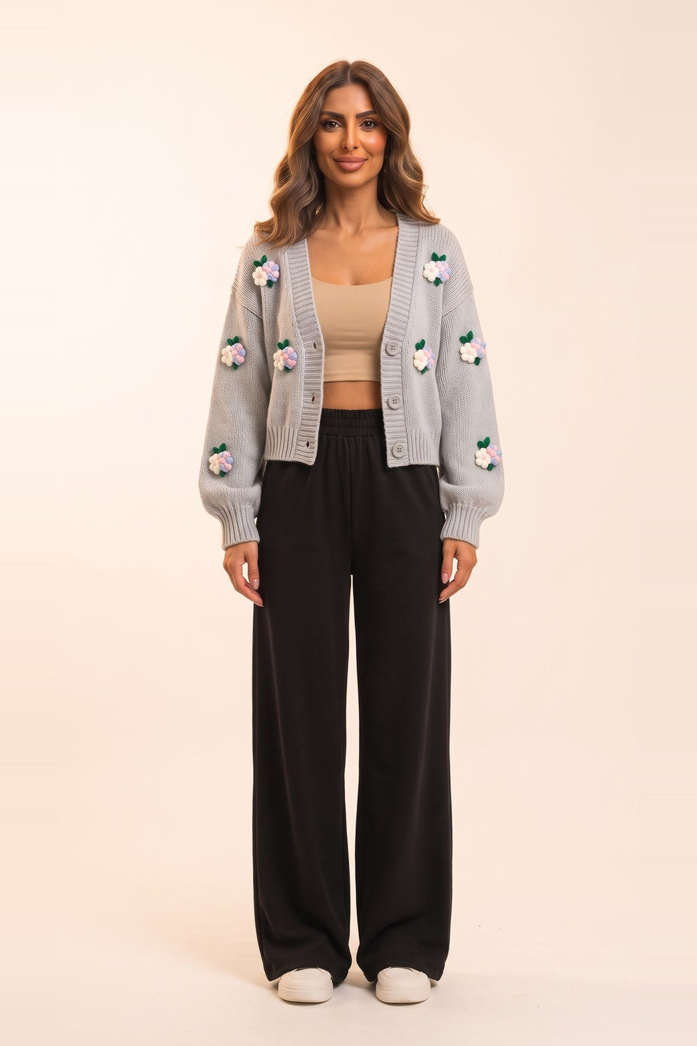 Women's grey cropped cardigan and black wide leg pants set – 3D flower appliqué knit cardigan, on model | Topline Lebanon