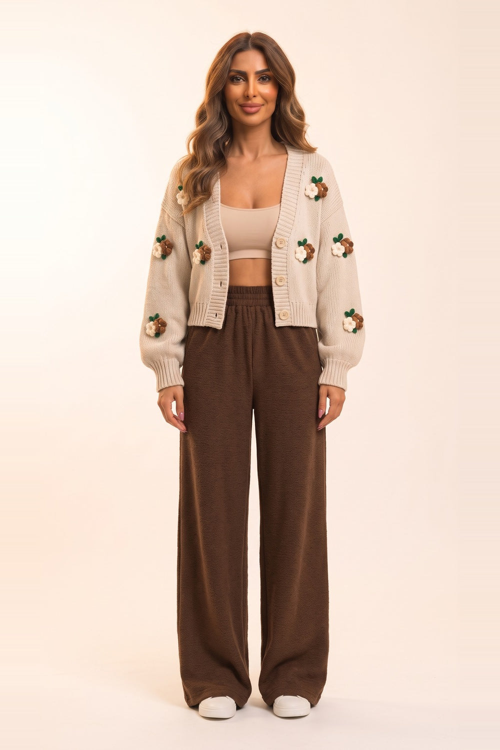 Women's cream cropped cardigan and chocolate wide leg pants set – 3D flower appliqué knit cardigan, on model | Topline Lebanon