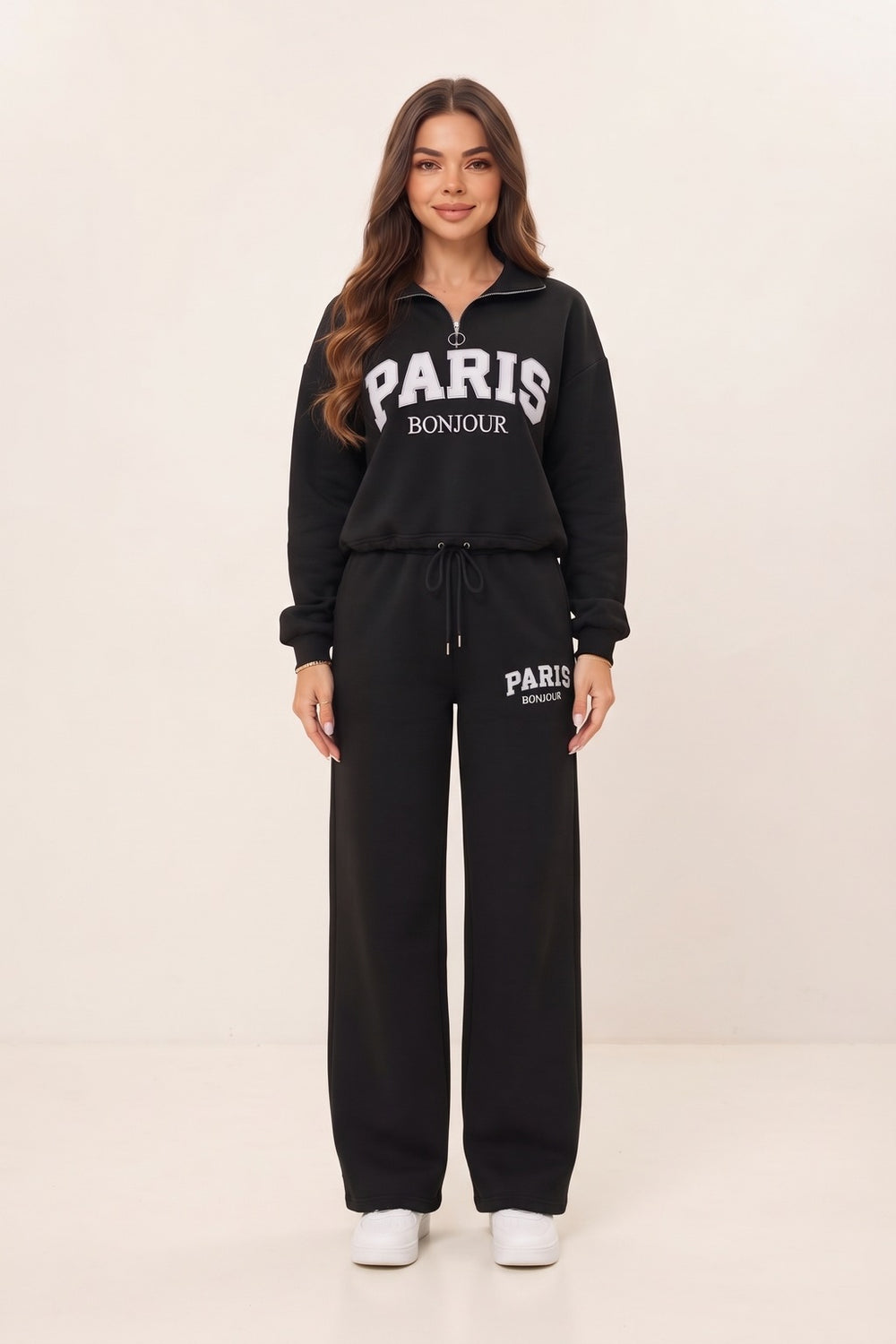 Women's black half zip sweatshirt and wide leg sweatpants set – PARIS letter print, drawstring waist, on model | Topline Lebanon