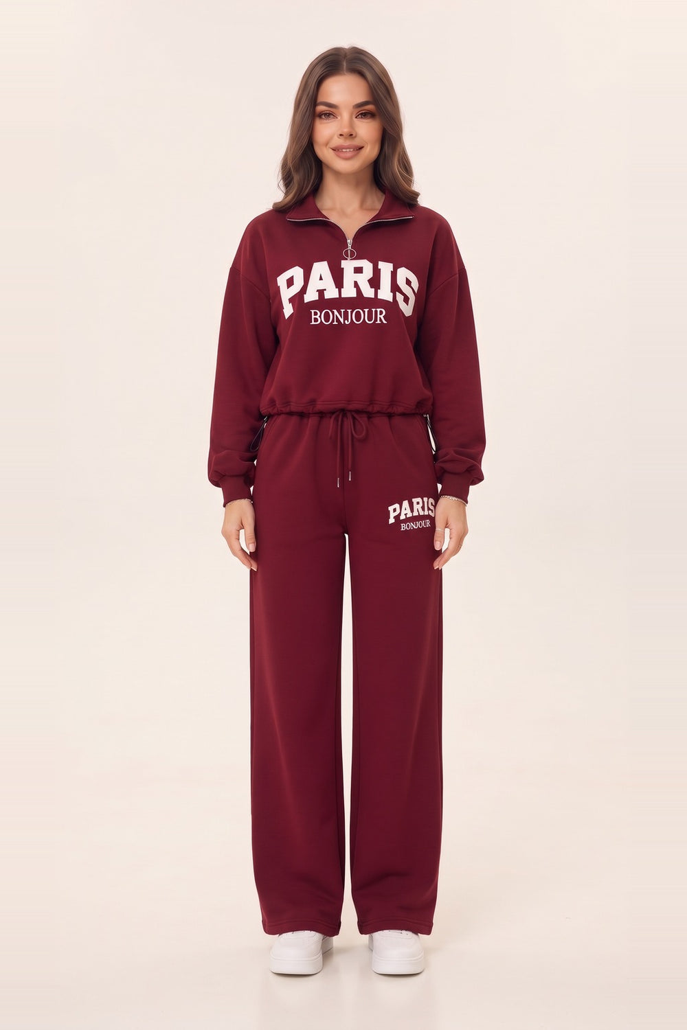Women's burgundy half zip sweatshirt and wide leg sweatpants set – PARIS letter print, drawstring waist, on model | Topline Lebanon