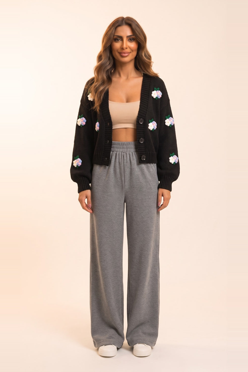 Women's black cropped cardigan and grey wide leg pants set – 3D flower appliqué knit cardigan, on model | Topline Lebanon