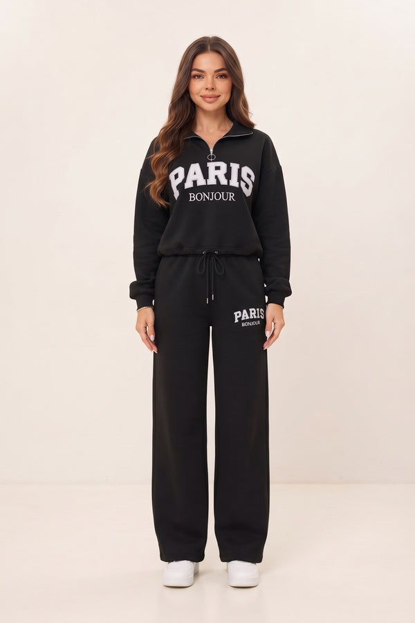 Women's black half zip sweatshirt and wide leg sweatpants set – PARIS letter print, drawstring waist, on model | Topline Lebanon