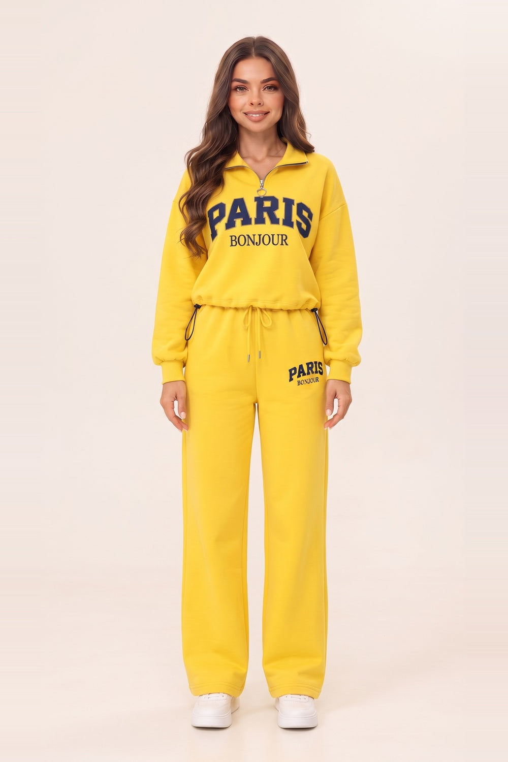 Women's yellow half zip sweatshirt and wide leg sweatpants set – PARIS letter print, drawstring waist, on model | Topline Lebanon