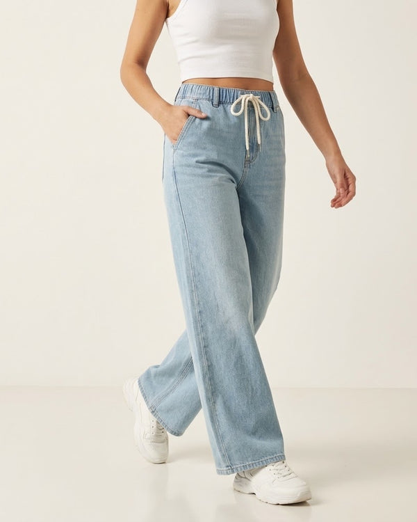Women's light blue drawstring wide-leg jeans on model