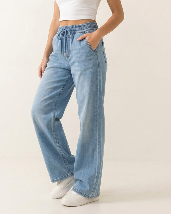 Women's light blue drawstring wide-leg stretch jeans on model