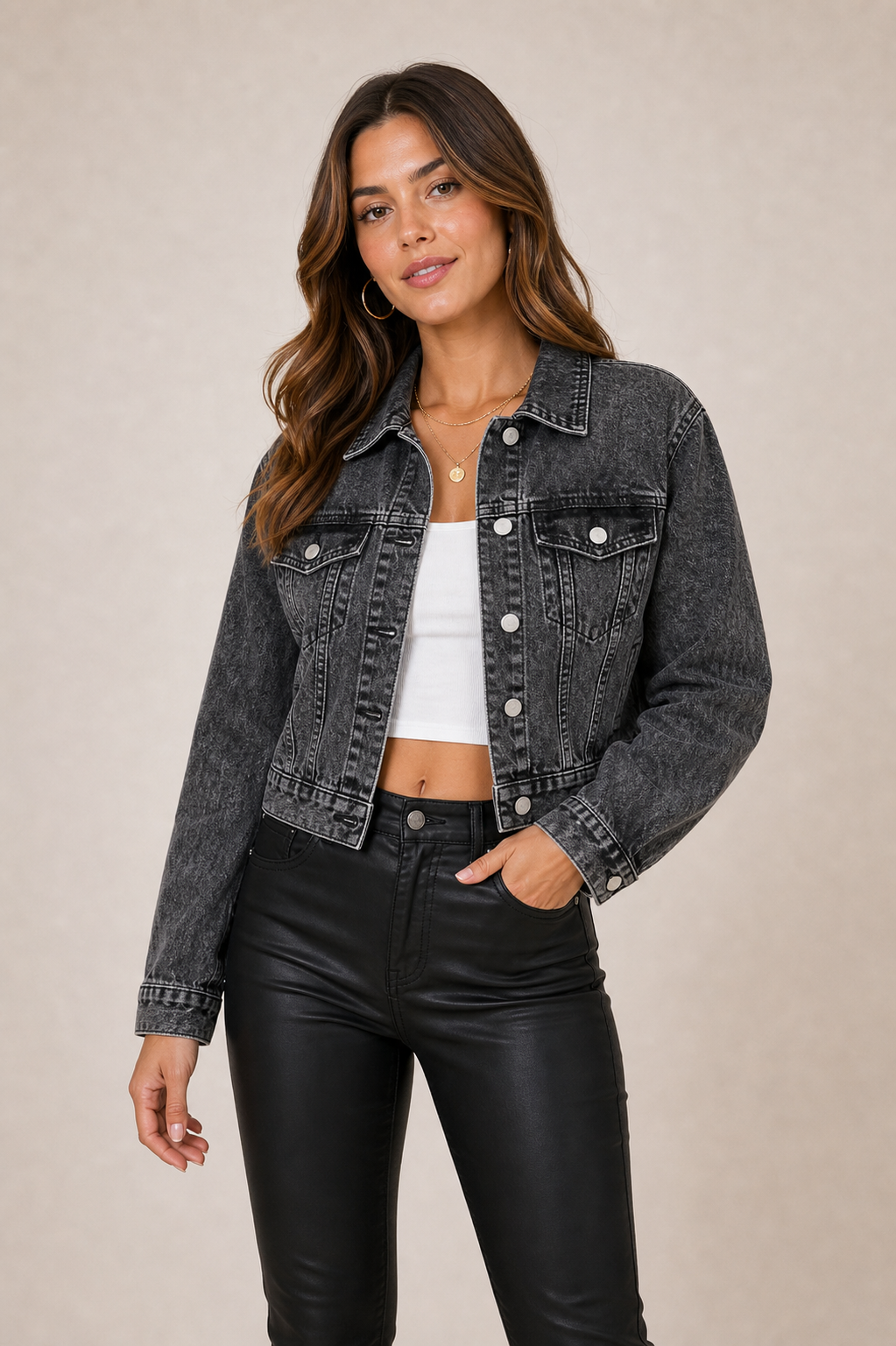 Cropped black denim jacket on model